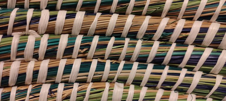 a close up of a pile of woven material